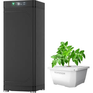 A tall black grow tent with a digital display panel beside a white hydroponic container holding a green plant.