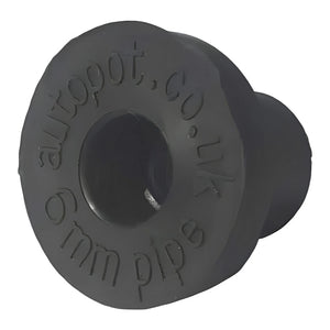Black rubber 3/8" top hat grommet for hydroponic pipe connections, featuring embossed text on its flat circular rim.