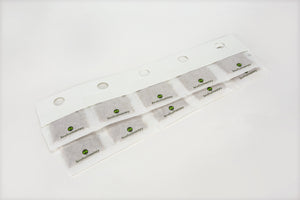 A strip of white paper sachets containing predatory Amblyseius swirskii mites for natural pest control in gardens.