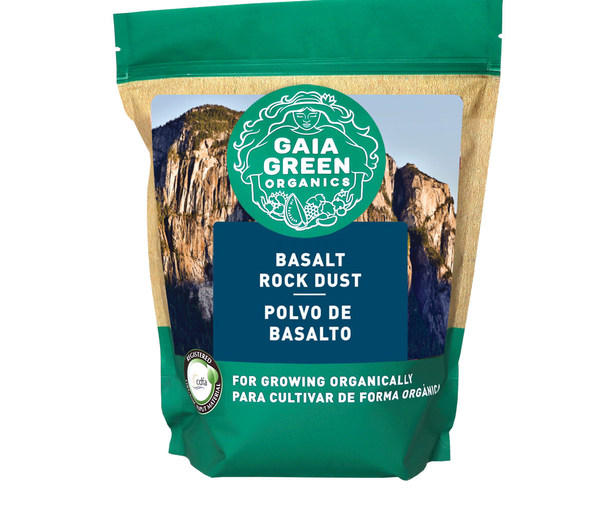 A bag of Gaia Green Basalt Rock Dust with green packaging and a mountain landscape graphic, used for organic gardening.
