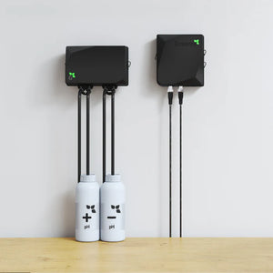 Growee pH Combo Doser: Two matte black geometric wall units with tubes connecting to white pH solution bottles.