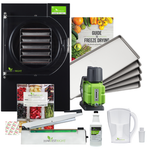 Harvest Right black medium freeze dryer, 5 metal trays, green vacuum pump, Mylar kit, and accessories for food storage.