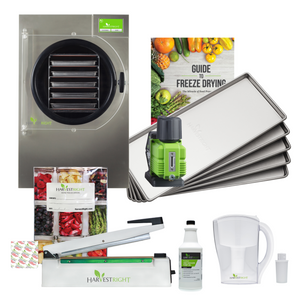 Stainless steel Harvest Right medium freeze dryer with 5 trays, vacuum pump, sealer, guide, and Mylar bag kit.