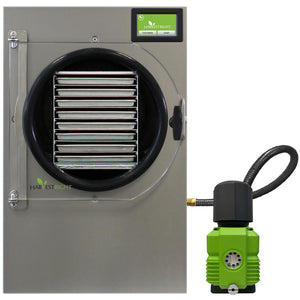 Stainless steel Harvest Right pharmaceutical freeze dryer with clear door, internal trays, and attached green vacuum pump.
