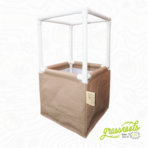Hobby Grow living soil raised bed featuring a tan fabric container and a white PVC frame for plant support.