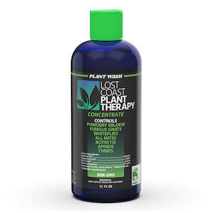 A blue plastic bottle of Lost Coast Plant Therapy concentrate with a green cap, used for controlling garden pests.