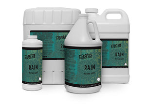 Four white plastic jugs of Roots Organics Rain wetting agent, featuring teal labels with floral patterns.