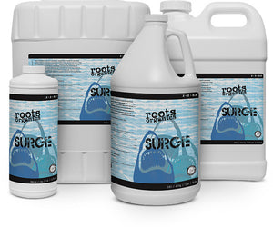 White plastic bottles and jugs of Roots Organics Surge plant nutrient, featuring a shark graphic on the label.