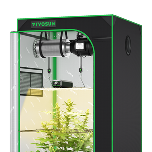 Black and green grow tent containing a ventilation system, hanging grow light, and green plant.