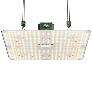 Rectangular LED grow light hanging by ropes against a black background, with visible white, yellow, and red diodes.