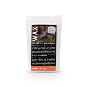 Clear plastic pouch of inoculation wax with a black and white label featuring product details.