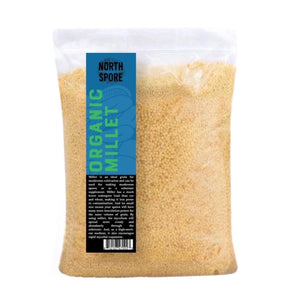 Clear plastic bag of yellow organic millet grain with a blue North Spore label.
