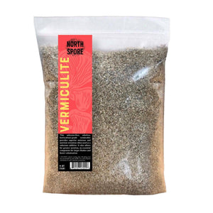 Clear plastic bag filled with gray vermiculite, featuring a red and yellow label reading "North Spore Vermiculite".