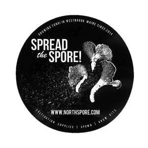 Round black sticker with white text "Spread the Spore!" and graphic of three mushrooms.