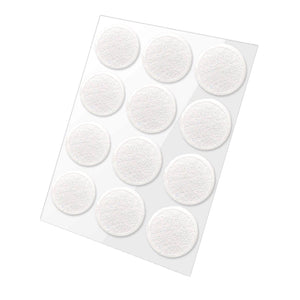 Twelve white, round, textured grip stickers arranged in four rows on a clear sheet.