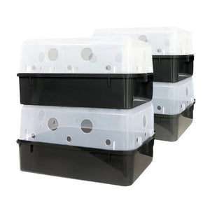 Two stacks of black breeding boxes with translucent plastic lids featuring various-sized ventilation holes.