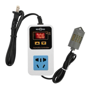 White North Spore humidity controller with digital display, blue outlet, power plug, and gray sensor probe on black cords.