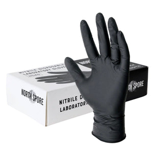 A single black nitrile glove in front of a white and black product box.
