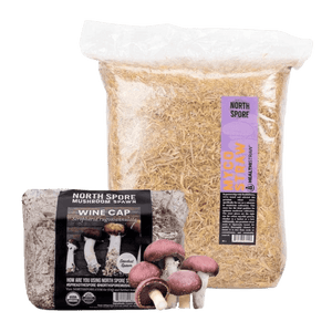 A bag of Myco Straw and a brick of Wine Cap sawdust spawn with harvested mushrooms.