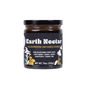 A glass jar of Earth Nectar mushroom-infused honey with a black label, white text, and yellow mushroom illustrations.