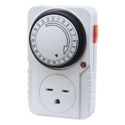 White wall-plug timer with a 24-hour circular dial, manual override switch, and a single three-prong outlet.