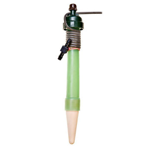 Green irrigation spike with ceramic cone tip, dark green cap, and attached black tubing with a barbed connector.