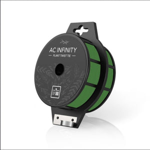 Green plant twist tie on a black spool with a built-in metal cutter, viewed from a slightly elevated angle.