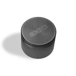 Matte black AC Infinity herb grinder viewed from above, featuring a circular design with etched branding.