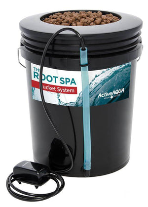 Black bucket hydro system with water level tube, clay pebbles, and external air pump on white background.