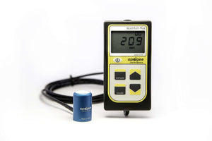 Apogee Instruments quantum flux meter with handheld display, control buttons, and wired external blue sensor head.