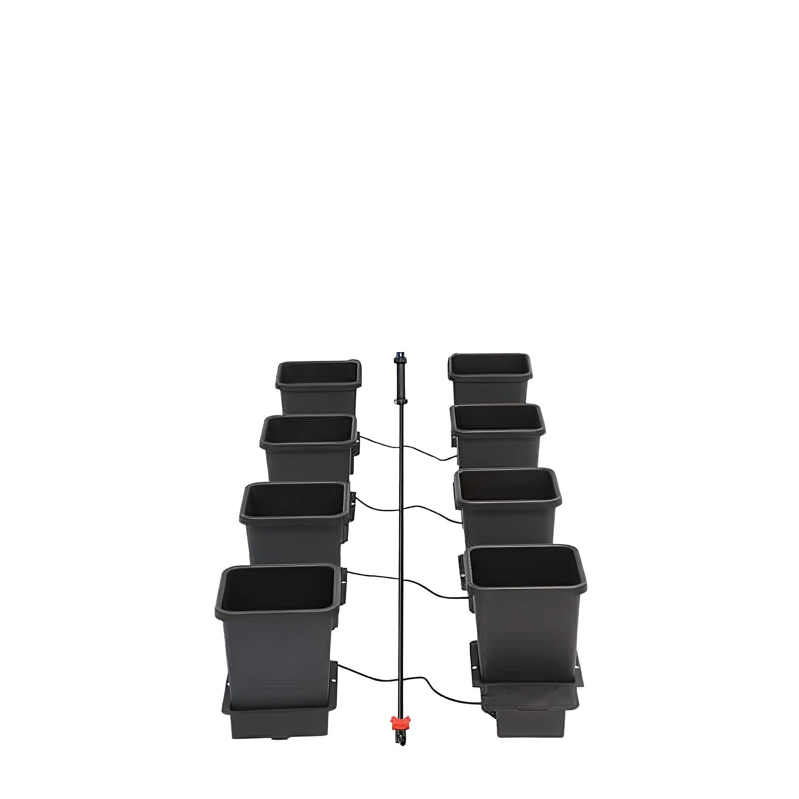 Eight black square hydroponic pots arranged in two rows connected by tubing and a central irrigation manifold.