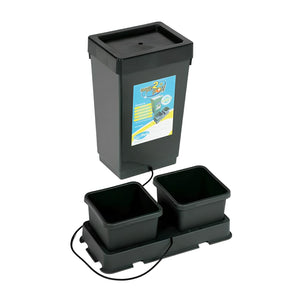 Black reservoir connected by tubing to a double-pot tray for hydroponic gardening against a white background.