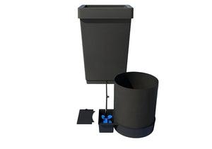 Hydroponic system with black reservoir, cylindrical growth pot, connecting pipe, and small valve box with blue float.