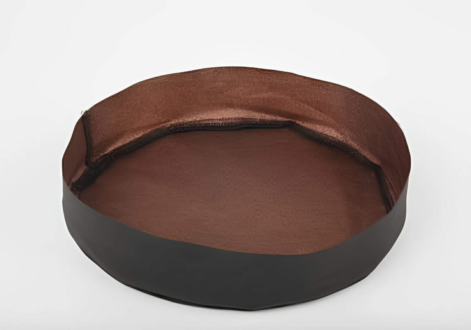 Round, shallow fabric grow tray with a matte black exterior and a smooth, metallic copper interior.