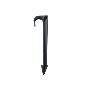 Black plastic irrigation stake with a top hook and a sharp, arrow-shaped bottom anchor. Side view on white.