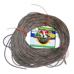 Coiled brown irrigation tubing for Tropf Blumat watering system, featuring an instructional label in the center.