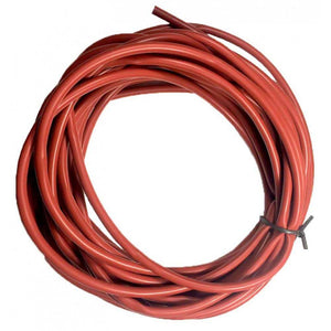 Coiled red irrigation tubing secured with a black zip tie against a white background.