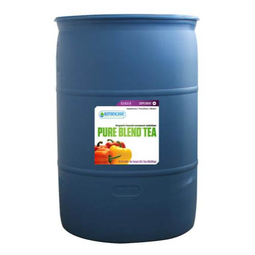 Large blue industrial plastic drum with a white Botanicare Pure Blend Tea label featuring red and yellow peppers.