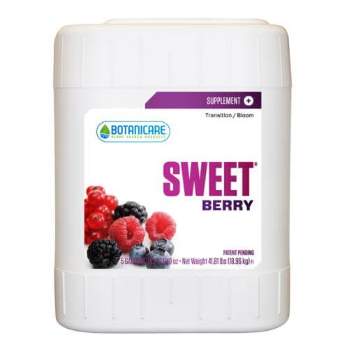 5-gallon white jug of Botanicare Sweet Berry plant supplement with berry illustrations on the label.