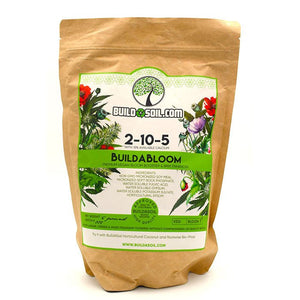 Brown paper pouch of BuildABloom 2-10-5 vegan plant fertilizer with green floral label, front-facing.