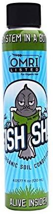 A 120ml bottle of organic soil conditioner featuring an OMRI Listed label and a cartoon fish reading a book.