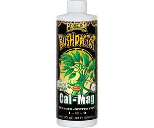 Pint bottle of FoxFarm Bush Doctor Cal-Mag fertilizer with a black label, green plant illustration, and white cap.