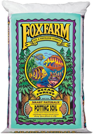 A bag of FoxFarm Ocean Forest potting soil with vibrant fish illustrations, deep blue background, and green pines.