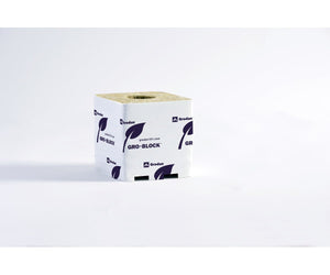 Square Grodan stone wool growing block in white plastic wrapping with purple leaf logos, viewed from a front angle.