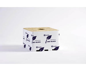 Square stone wool growing block in white plastic wrap with blue leaf logos and Grodan branding on a white background.