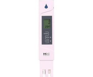 White HM Digital handheld water quality meter showing a digital display with 0 PPM and 23.4°C temperature.