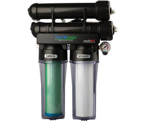 HydroLogic reverse osmosis unit with dual black filter housings, clear chambers, carbon/sediment filters, and gauge.