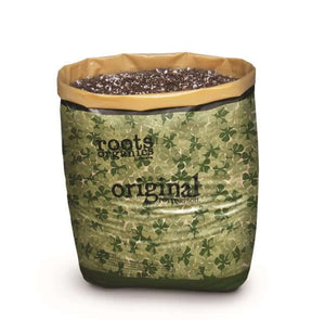 Open bag of Roots Organics potting soil showing dark, porous soil texture with white perlite particles.