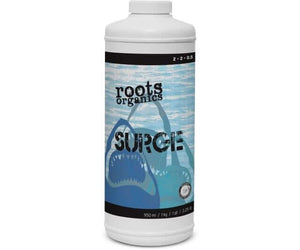 White 950ml bottle of Roots Organics Surge plant supplement featuring a blue shark graphic label.