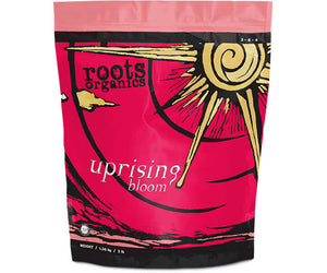Pink and black bag of Roots Organics Uprising Bloom fertilizer, 3lb size, with a gold sun graphic.